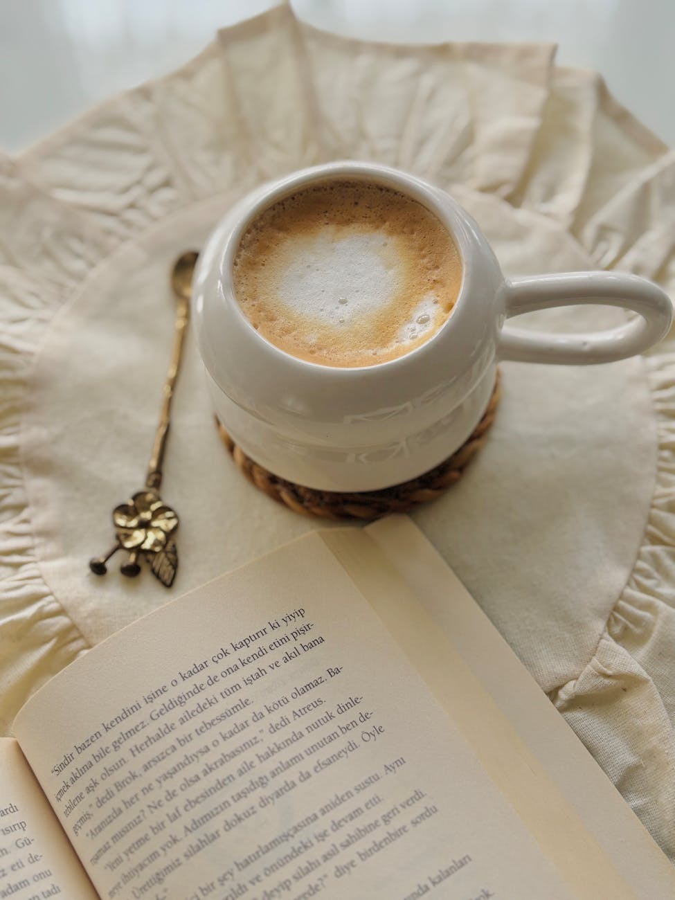 cozy coffee with open book and vintage spoon