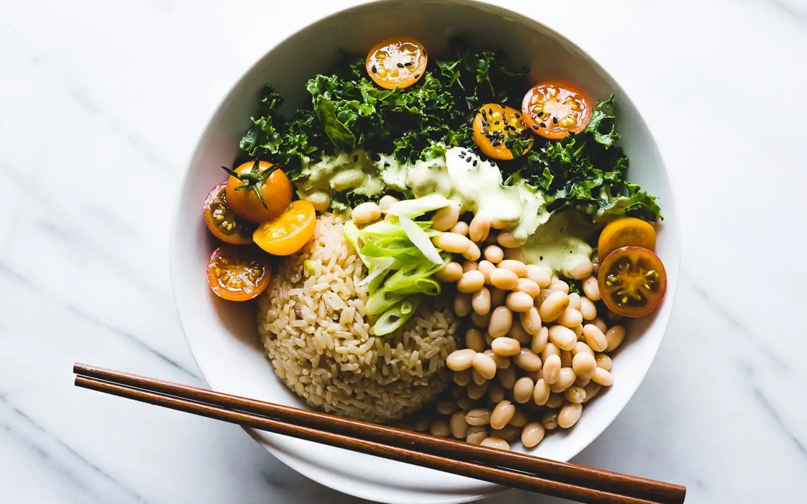 Fresh seasonal fruits, vegetables, and homemade meals arranged on a kitchen table for healthy, flavorful cooking throughout the year.